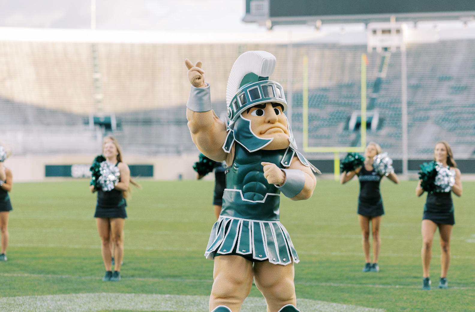 Sparty with the cheer team at Spartan Stadium